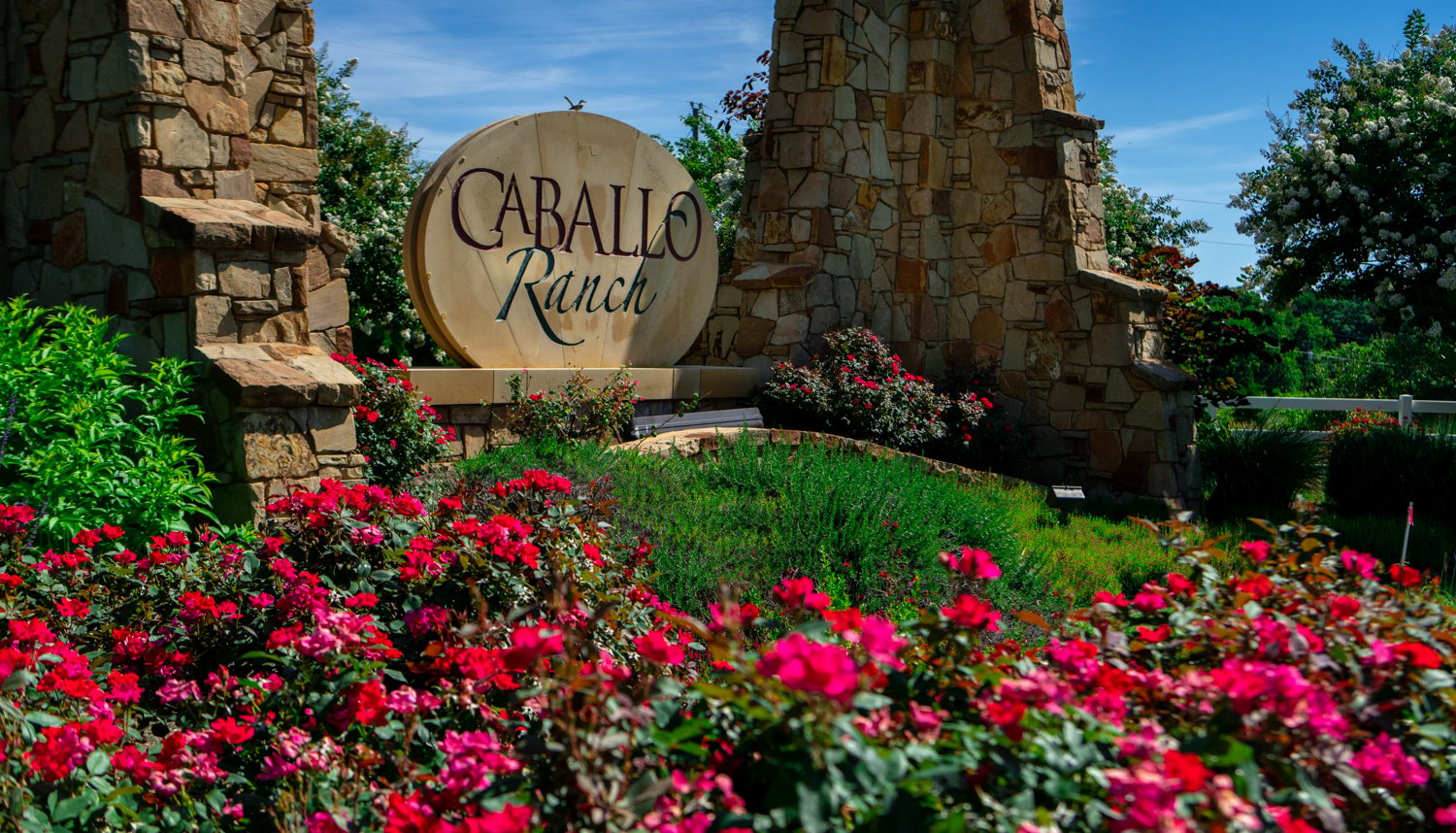 flowers and plantings at HOA community sign