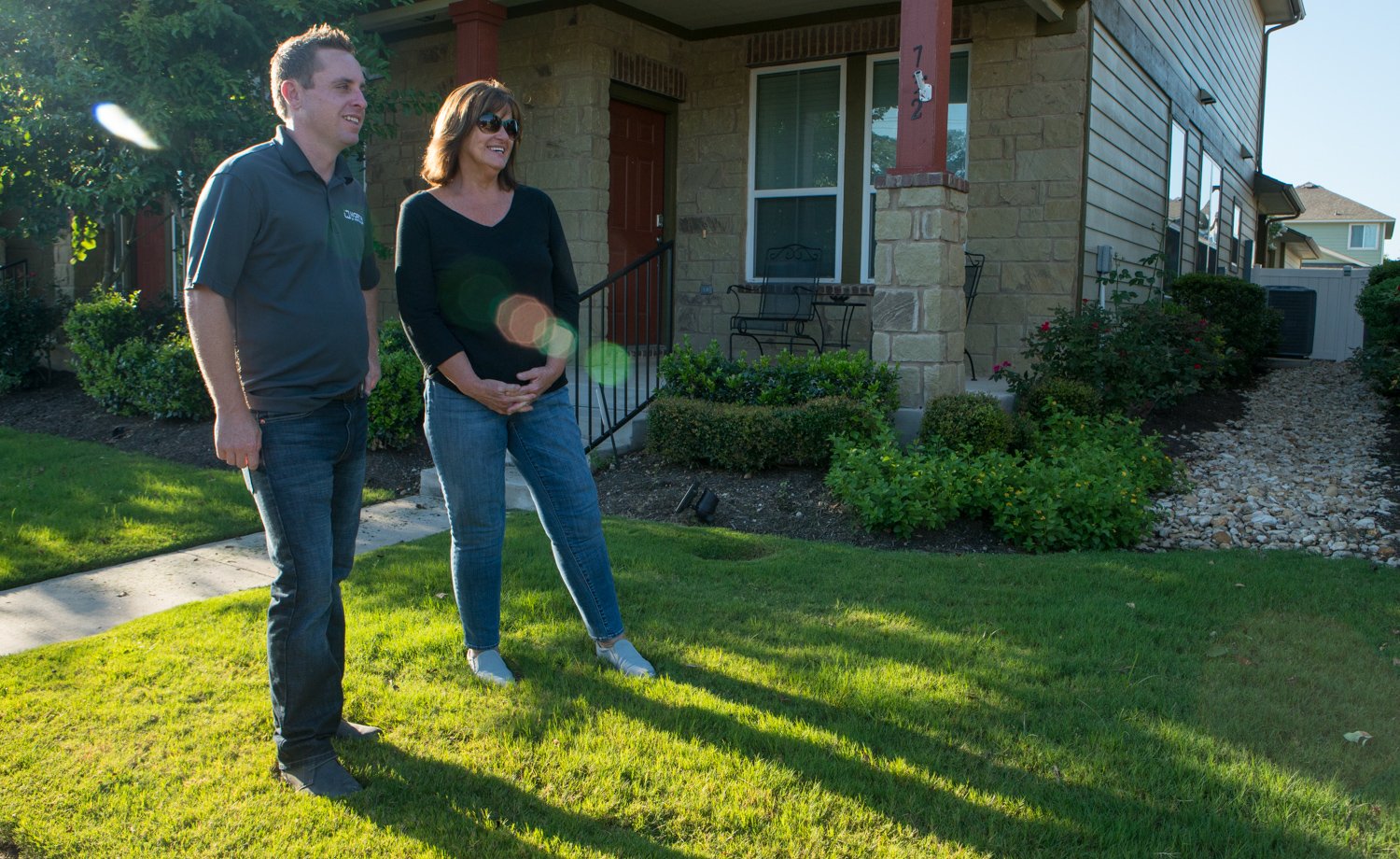 commercial landscaper speaking with HOA member