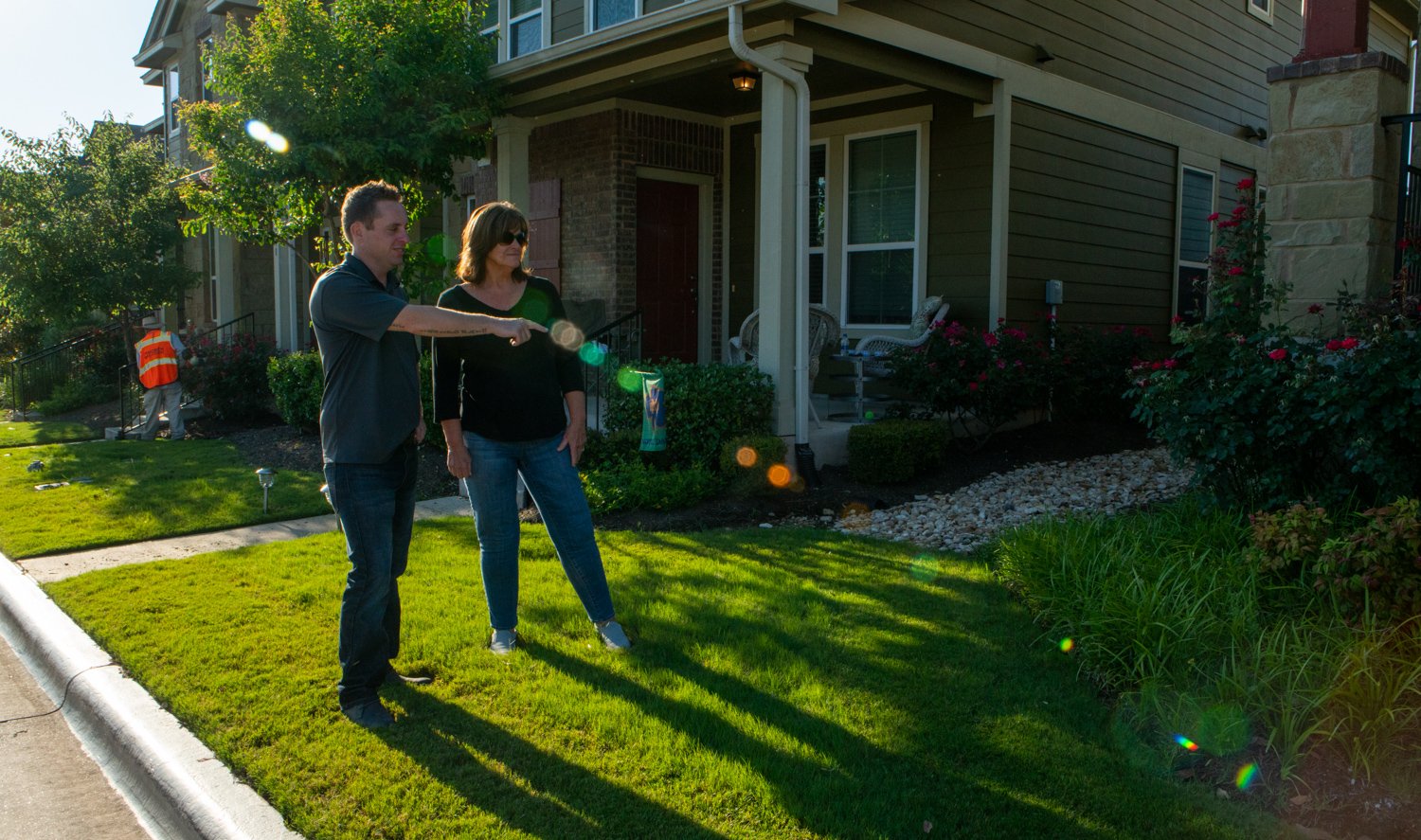 landscaping professional talking to HOA committee member 