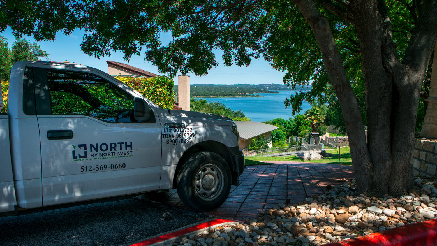 North By Northwest Landscaping truck near stone