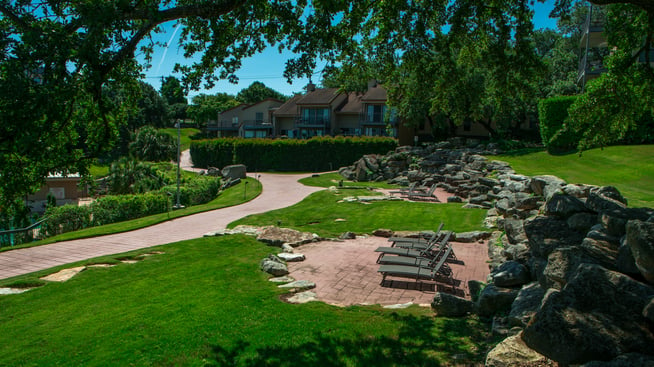 Trendy hardscaping and path at condo with community association