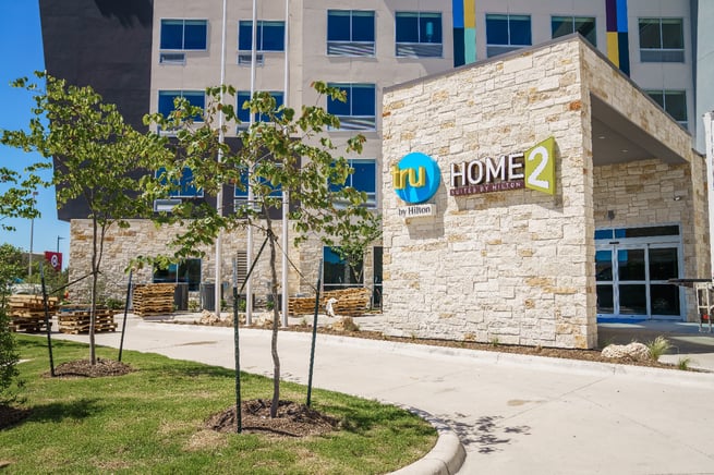 Tru and Home2 Suites By Hilton entrance and landscape