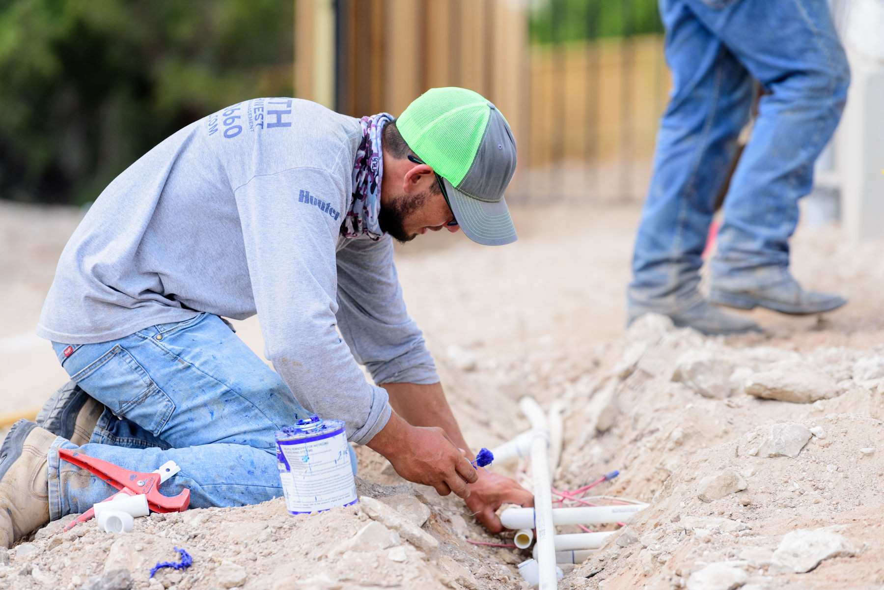 Irrigation technician installing a new sprinkler system