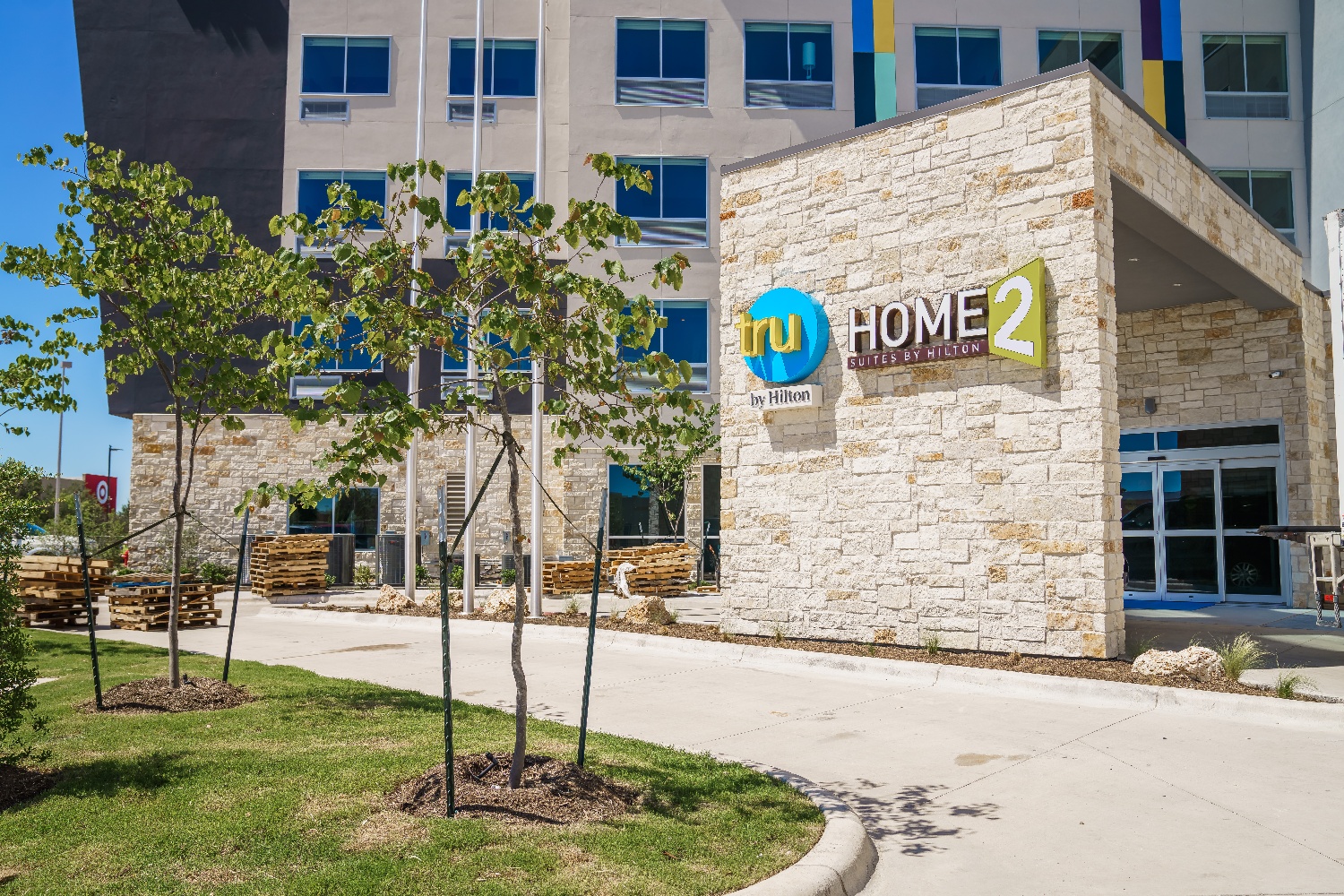 Tru and Home2 Suites by Hilton entrance and landscape in Texas